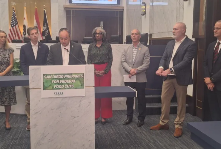 At Interfaith Community Services in Escondido, volunteers faced a parking lot...